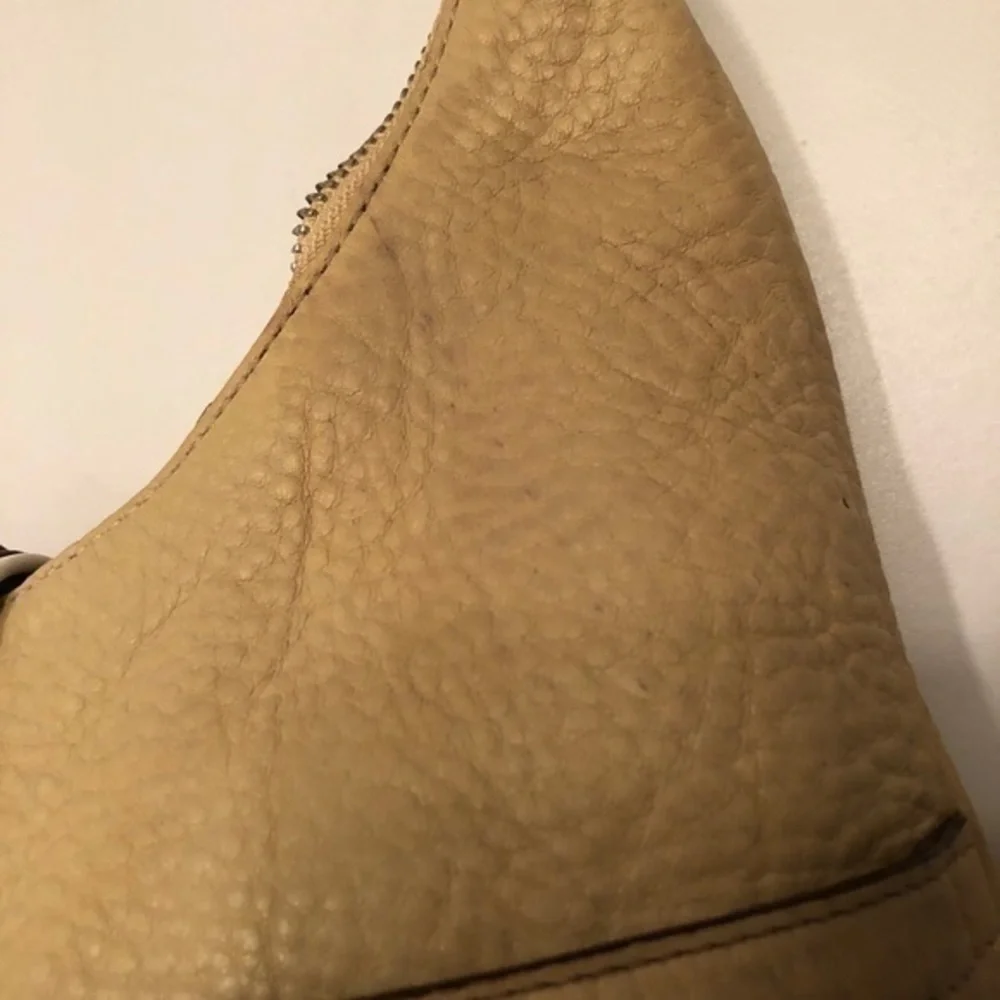 Coach cream pebbled leather perforated hobo bag